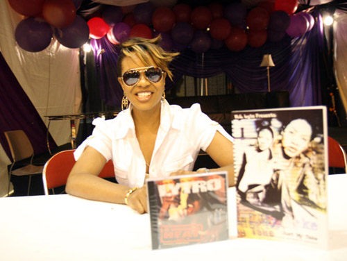 MC Lyte autographing her book at the 2007 Essence Music Festival